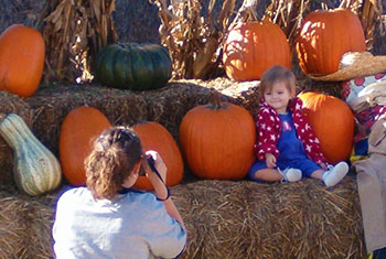 Our pumpkin display at Peckham's Pumpkin Patch is a great opportunity for photos. Stop by Pleasant Ridge Farm this fall for family fun and pumpkins!